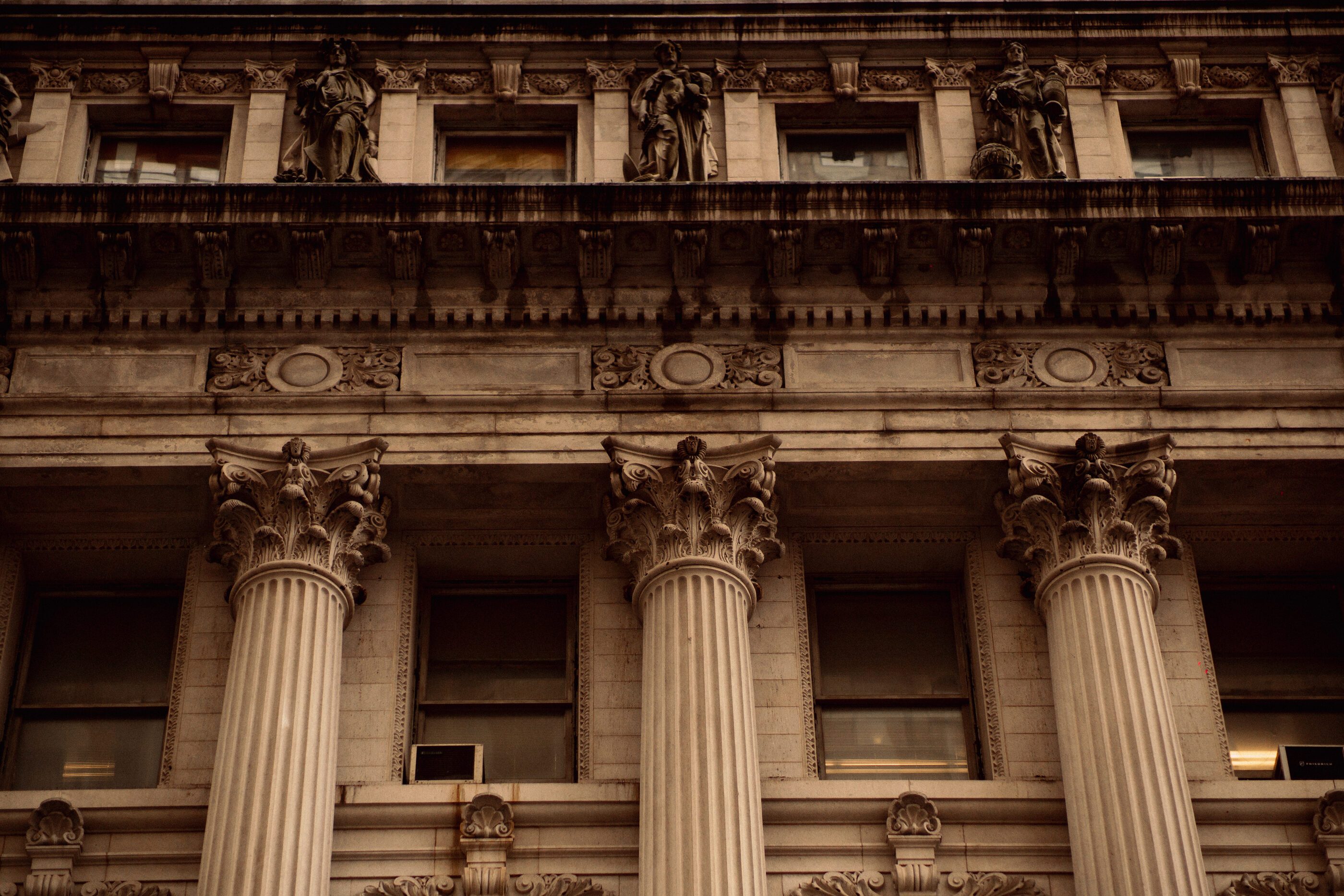 A neoclassical colonnade in hard afternoon light, New York